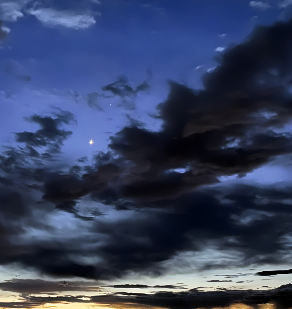 amber glow of the horizon breaks into early morning blue sky with clouds as hope comes after the hard-won truth takes hold