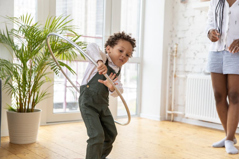 young boy with a hula hoop will eventually learn he can only control what happens on the inside